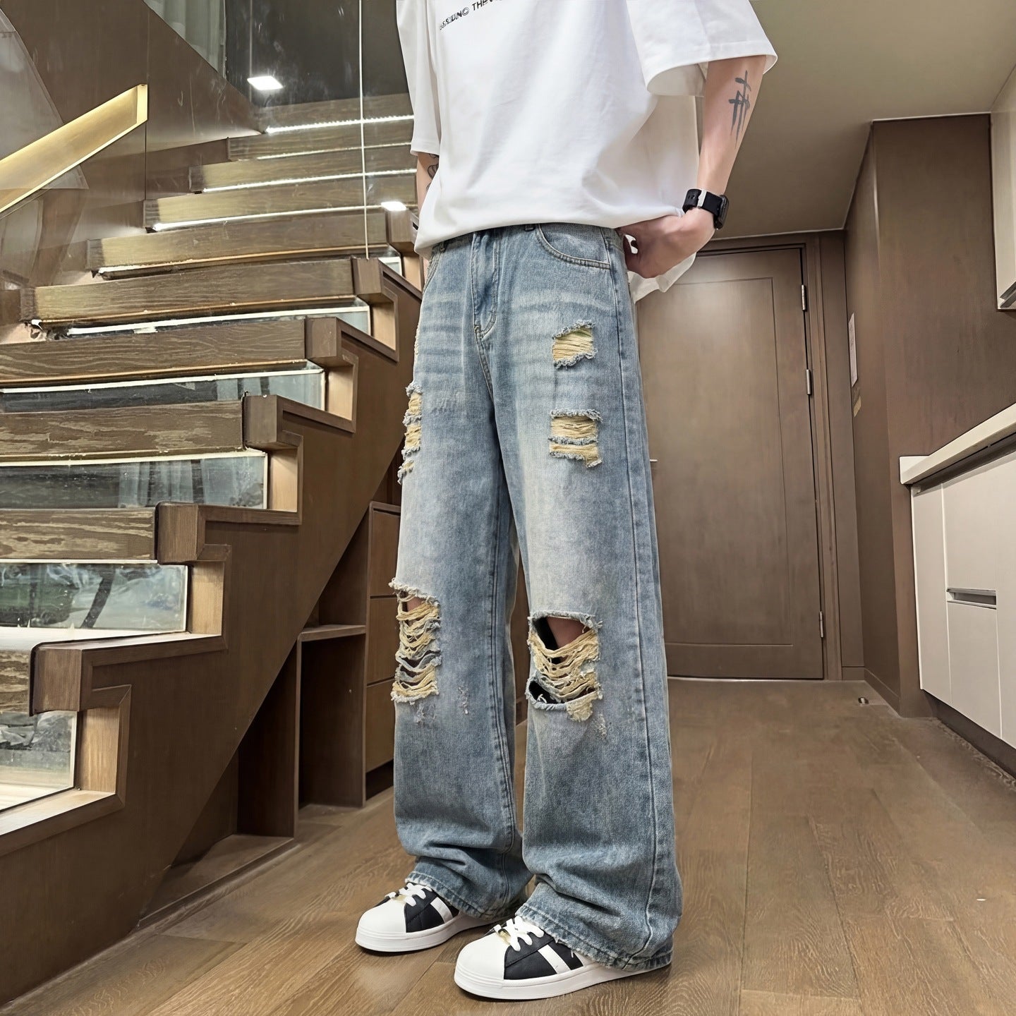 Light colored ripped jeans for men