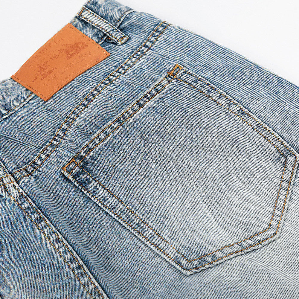 Light colored washed creased denim pants