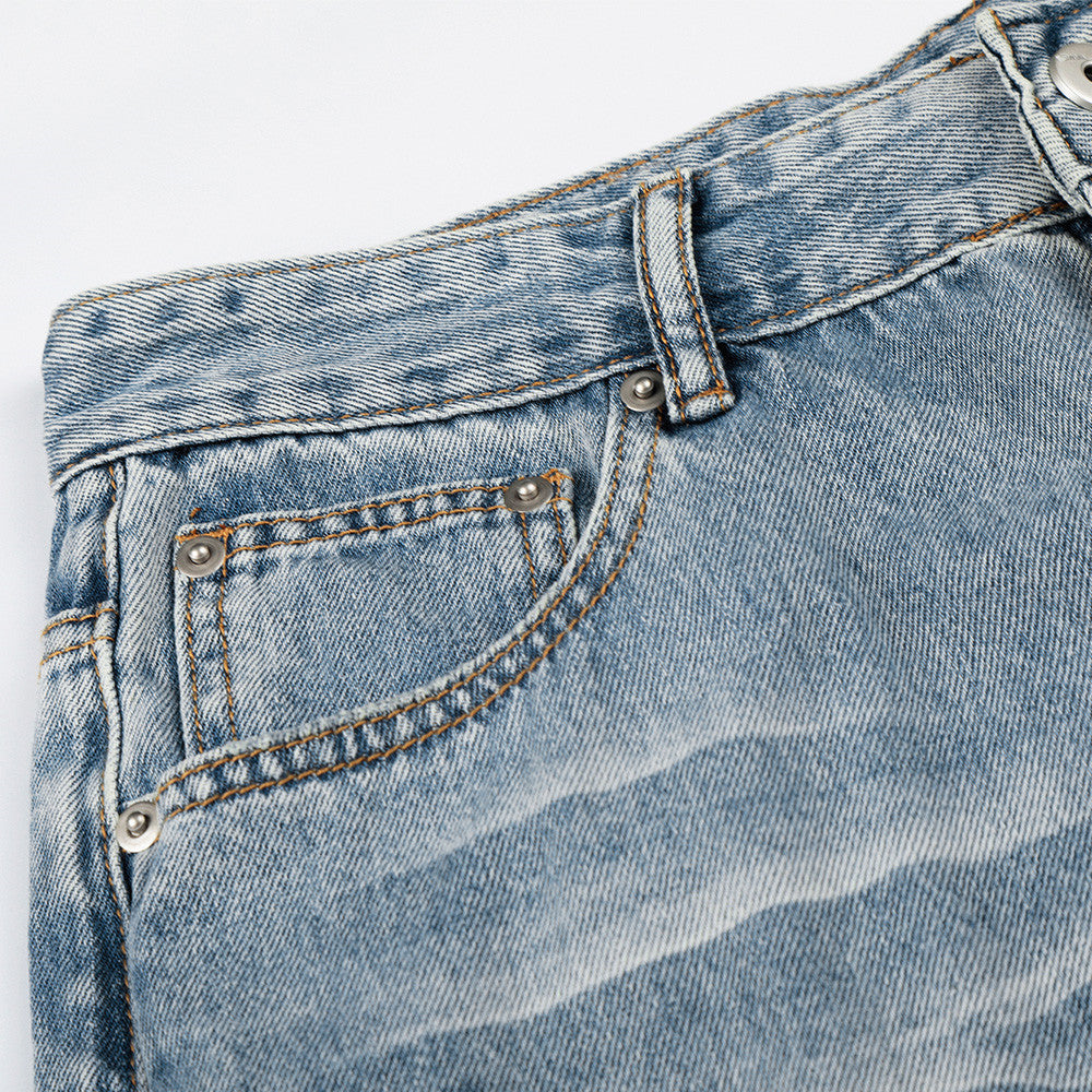 Light colored washed creased denim pants