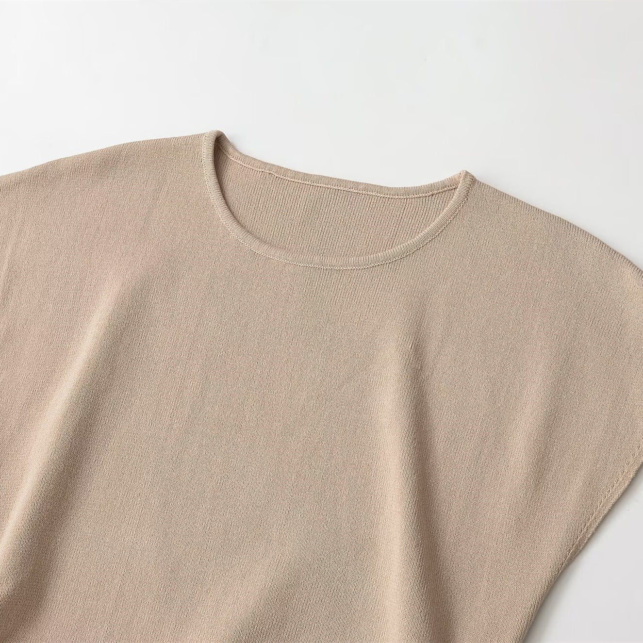 Sleeveless round neck side hollowed out decorative top