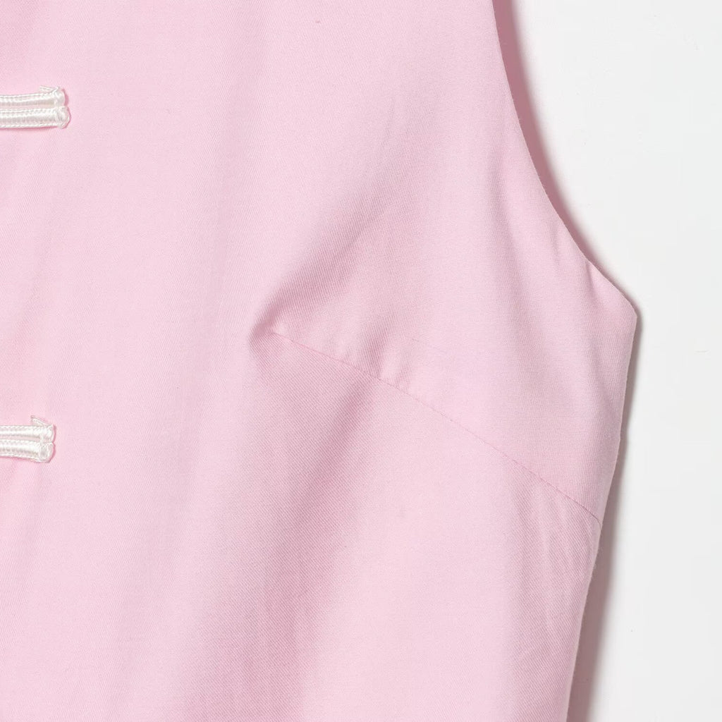 Sleeveless knot buckle embellished short skirt style hem top