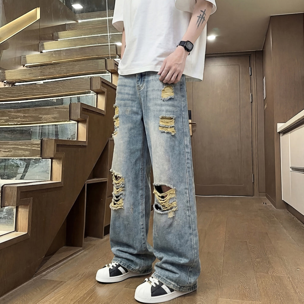 Light colored ripped jeans for men