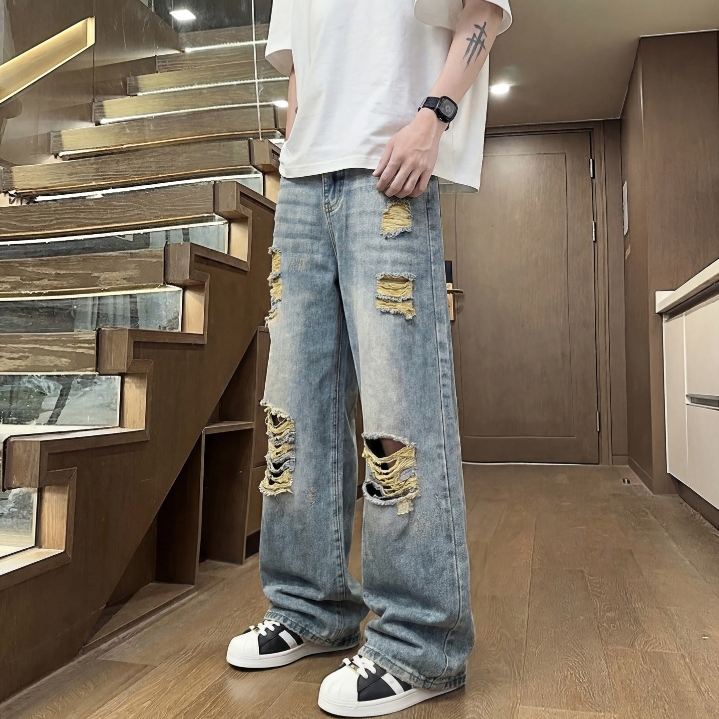Light colored ripped jeans for men
