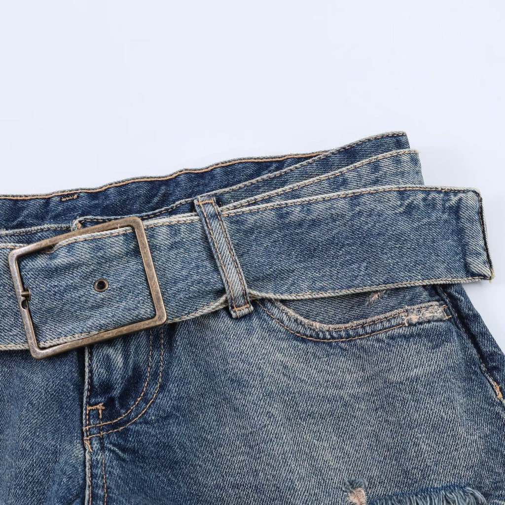 Spicy girl with belt and ripped denim shorts