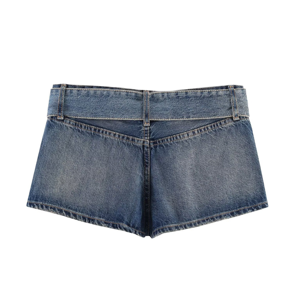 Spicy girl with belt and ripped denim shorts